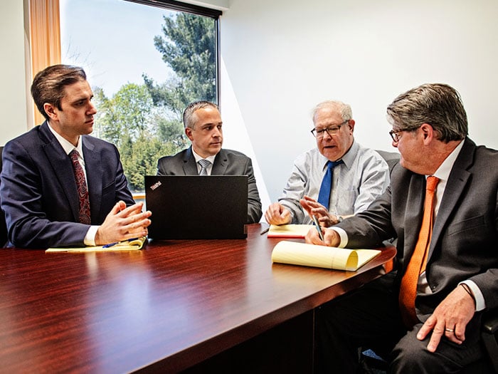Law Offices of Alan M. Cohen & Associates attorneys meeting with a client